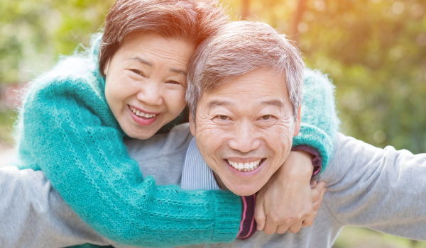 senior couple having discussion with medical professional