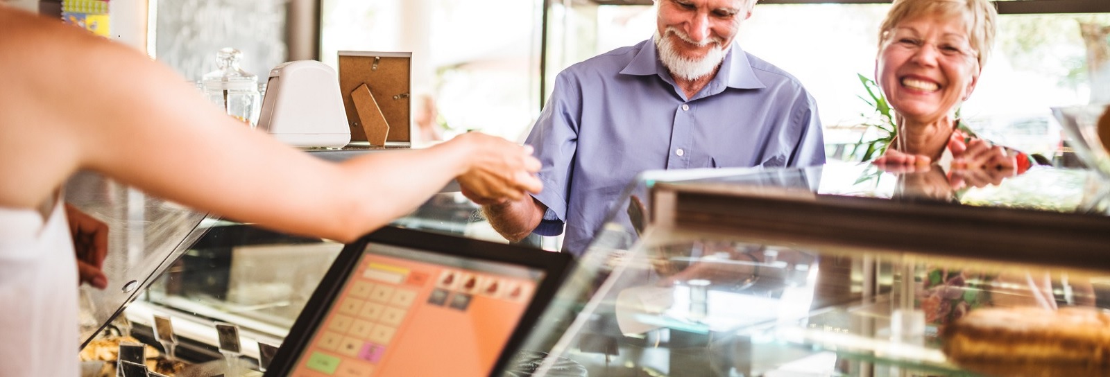 senior couple at checkout counter